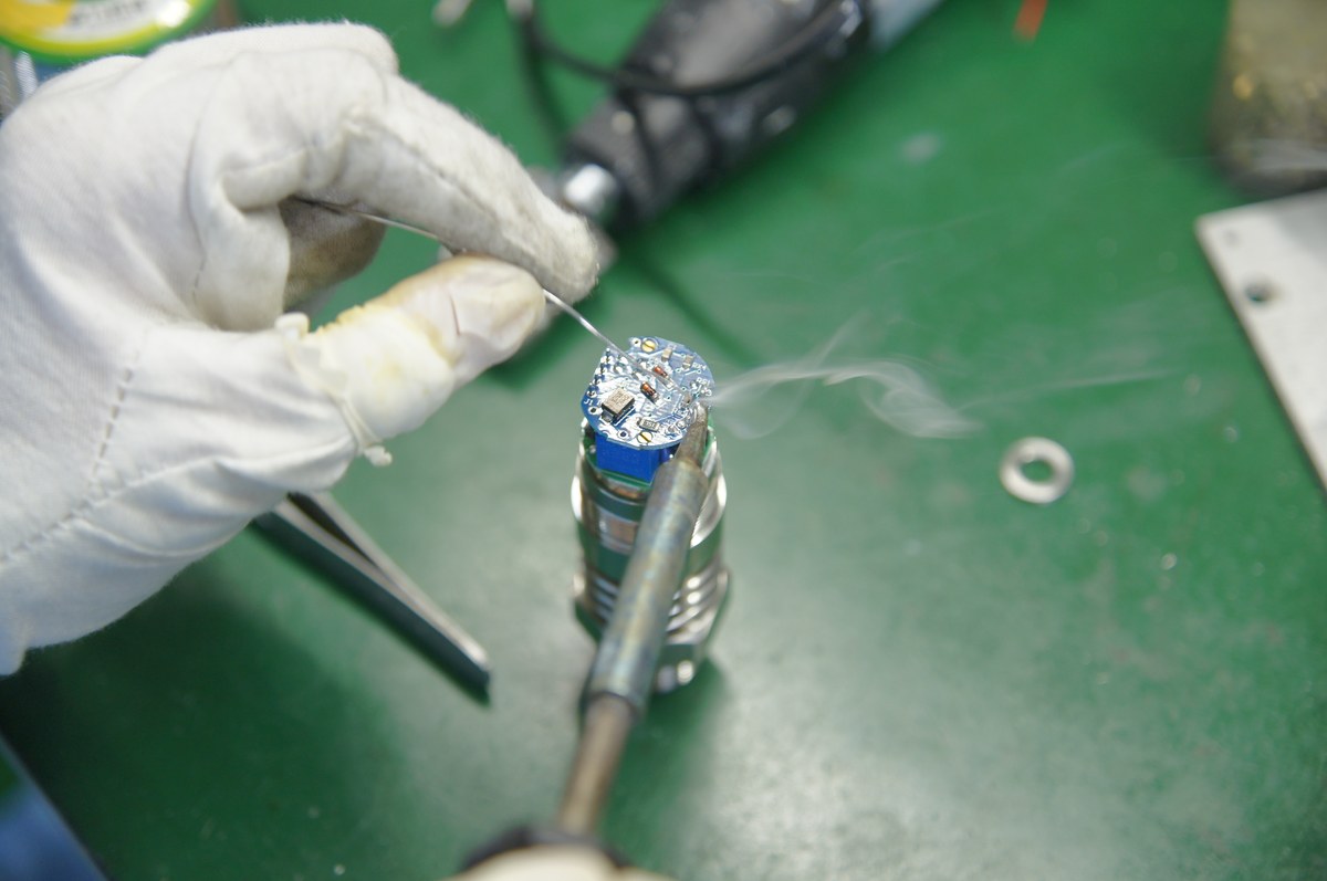Soldering a pressure sensor element and circuit board during transmitter assembly