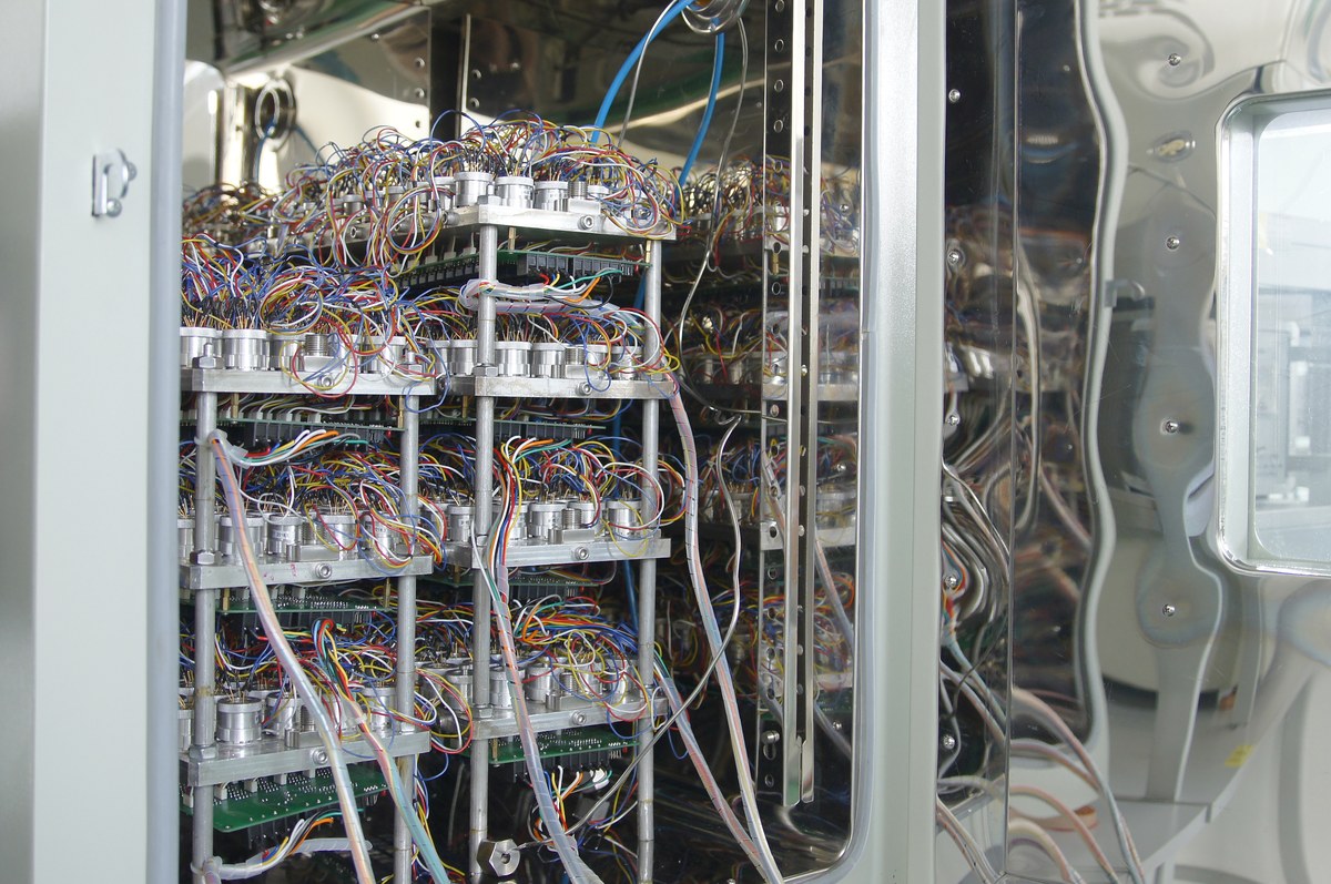 Ageing rack holding pressure sensors powered for burn-in before release